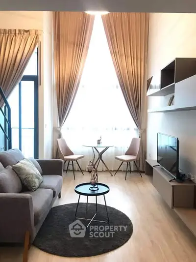 Modern living room with high ceilings and elegant decor