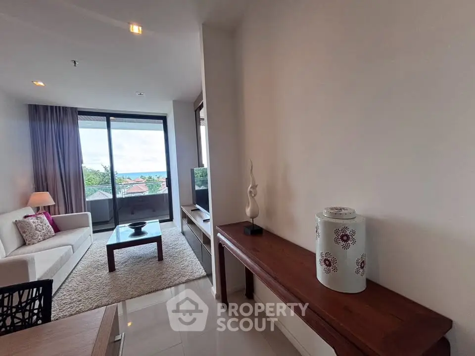Spacious living room with ocean view and elegant decor in modern apartment