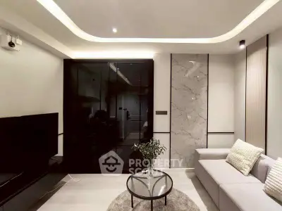 Modern living room with sleek design and elegant lighting