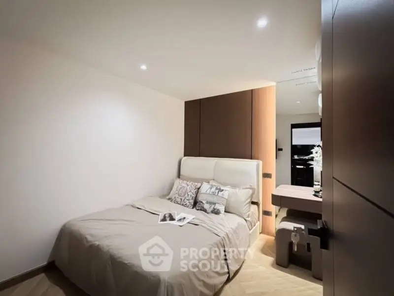 Cozy modern bedroom with elegant decor and soft lighting