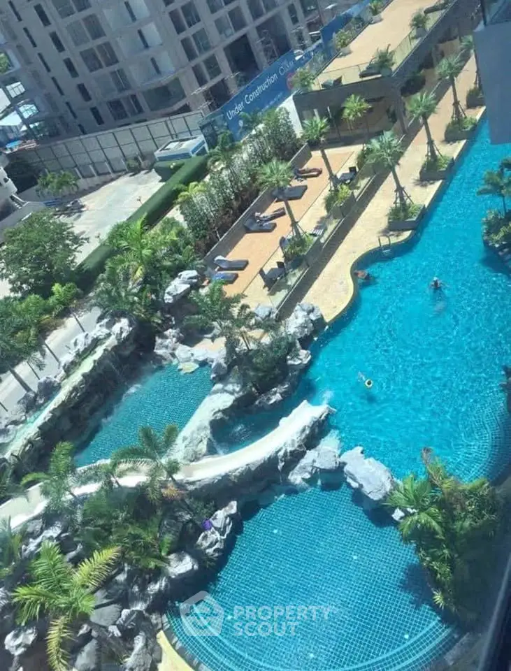 Luxurious residential complex with stunning pool and lush landscaping