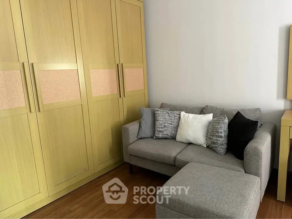 Cozy living room with modern sofa and spacious wardrobe