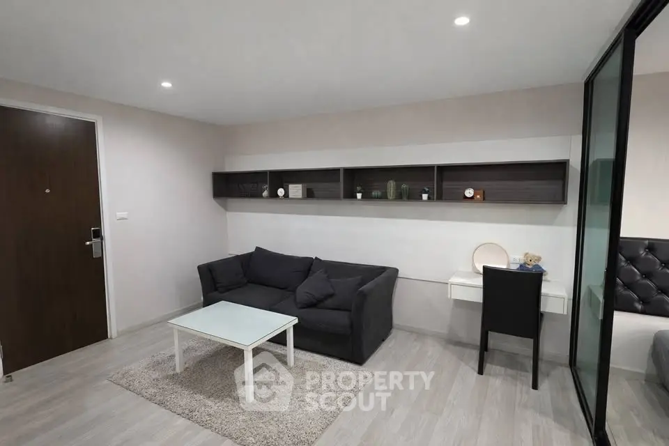 Modern living room with sleek furniture and stylish decor in a contemporary apartment.