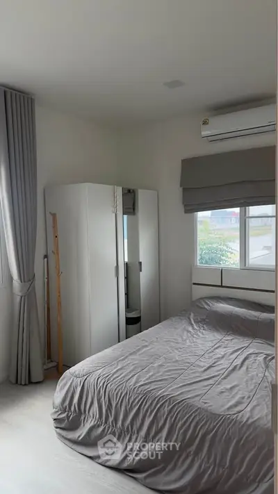 Cozy bedroom with modern decor and natural light