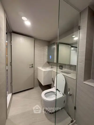 Modern bathroom with sleek design and glass shower enclosure