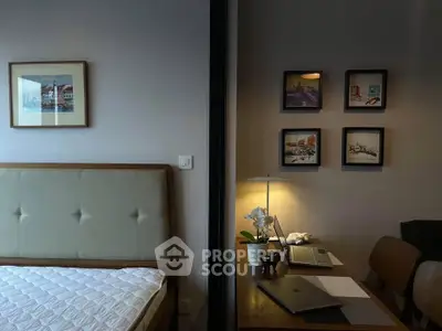 Stylish bedroom with adjacent study area featuring modern decor and cozy ambiance.