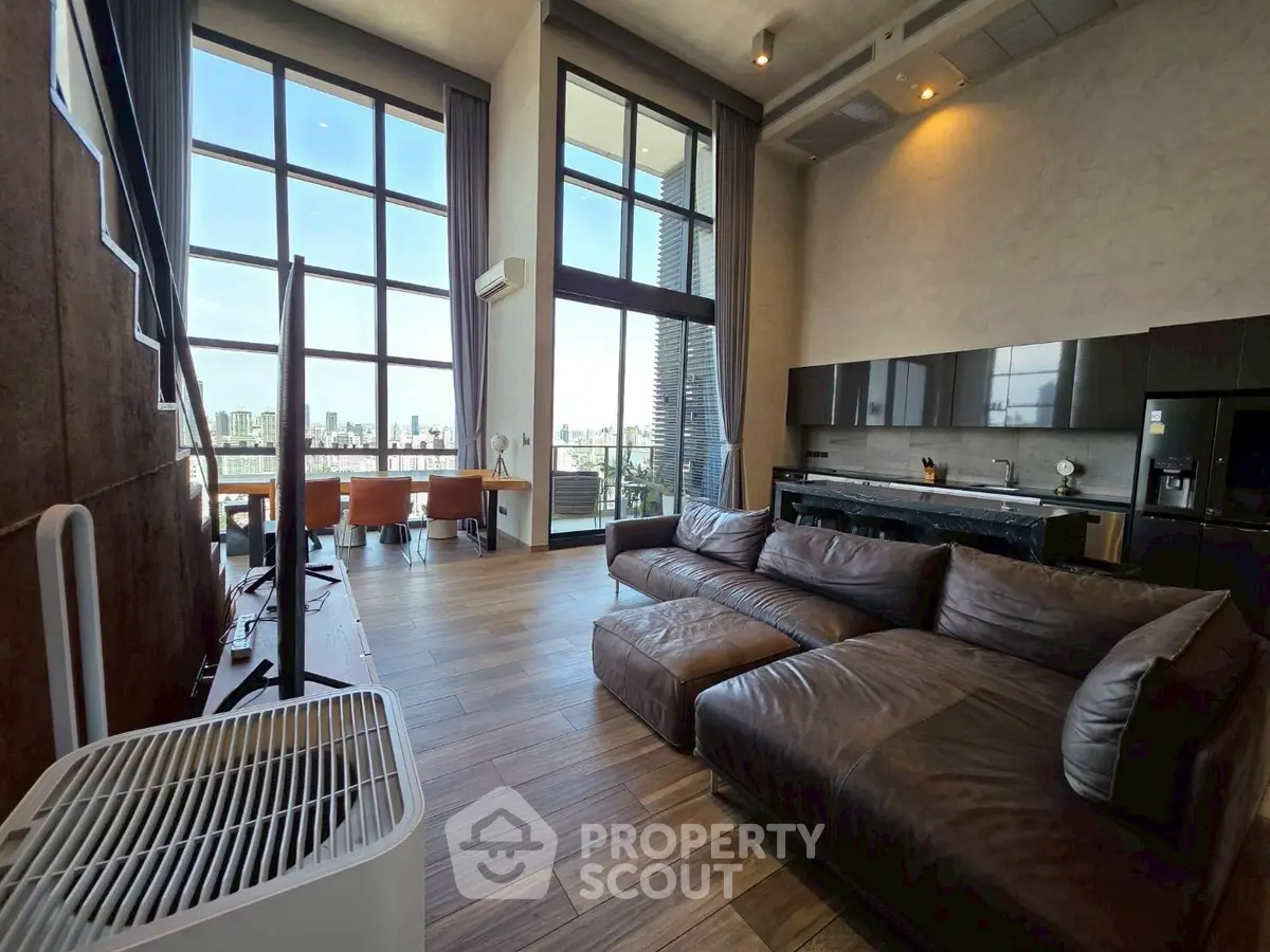 Luxurious modern living room with stunning city view and open kitchen layout