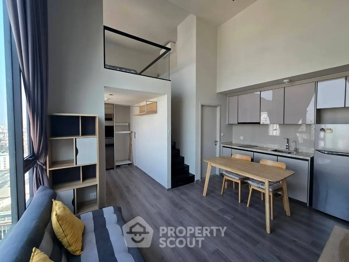 Modern loft apartment with open kitchen and mezzanine in city view