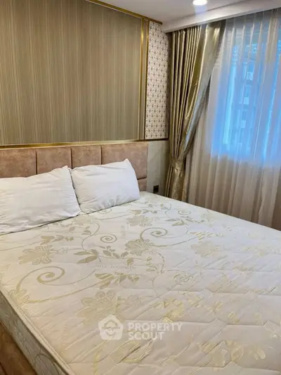 Luxurious bedroom with elegant decor and plush bedding