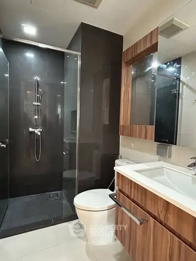 Modern bathroom with sleek shower and stylish wooden vanity