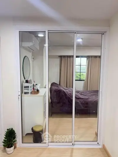 Modern bedroom with sliding glass doors and cozy decor