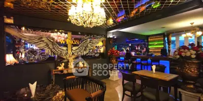 Luxurious bar area with elegant chandelier and artistic decor, perfect for entertaining guests.