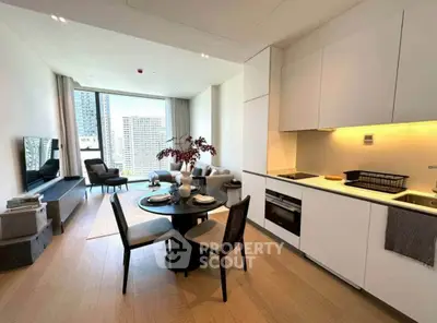 Modern open-plan living room with kitchen, featuring sleek design and city view.