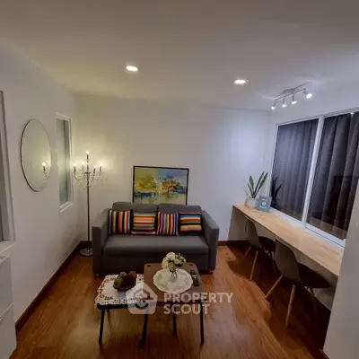 Modern living room with stylish decor and cozy seating area, perfect for relaxation and entertainment.