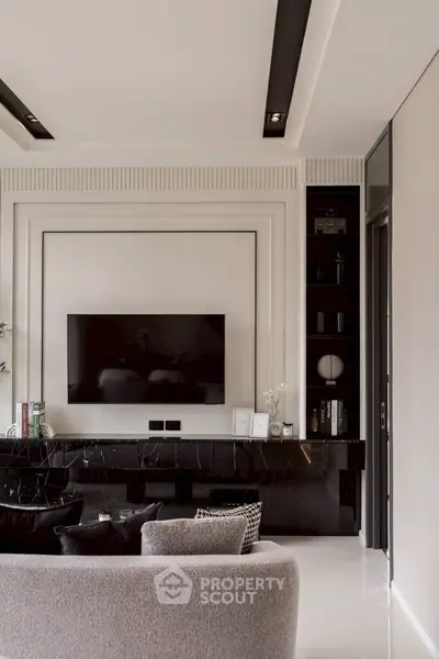 Elegant living room with modern TV setup and stylish decor