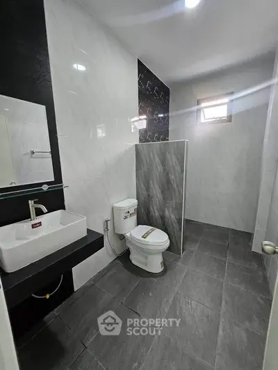 Modern bathroom with sleek design and elegant fixtures in a contemporary home.