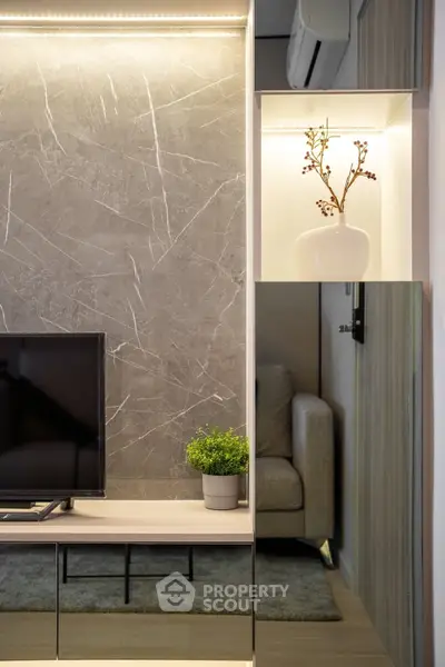 Modern living room with stylish decor and sleek TV setup