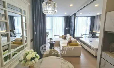 Luxurious open-plan living room with elegant decor and natural light