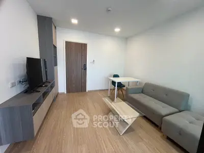 Modern living room with sleek furniture and wooden flooring