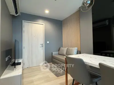 Modern living room with sleek furniture and stylish decor in a contemporary apartment.