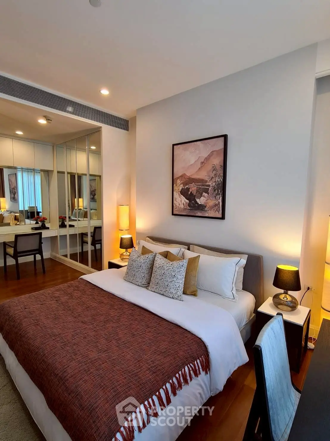 Luxurious bedroom with elegant decor and cozy ambiance, featuring a stylish bed and modern furnishings.