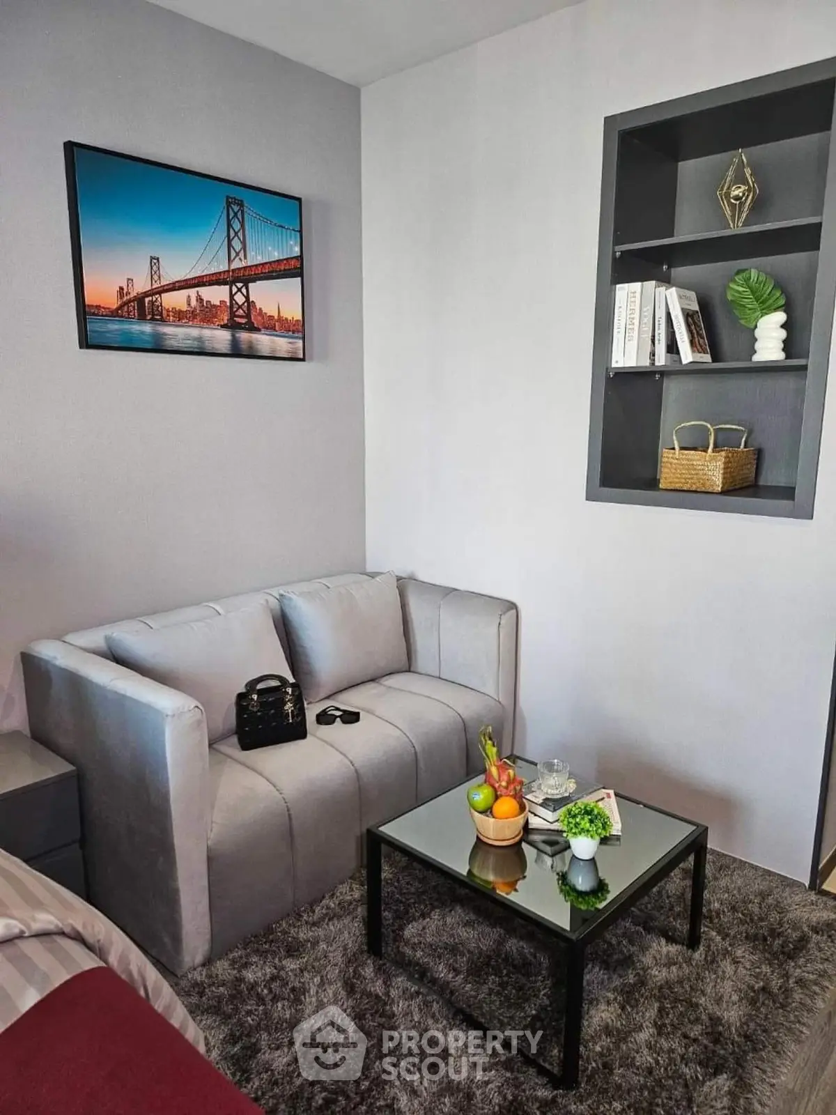 Cozy living room with modern decor and plush sofa, perfect for relaxation.