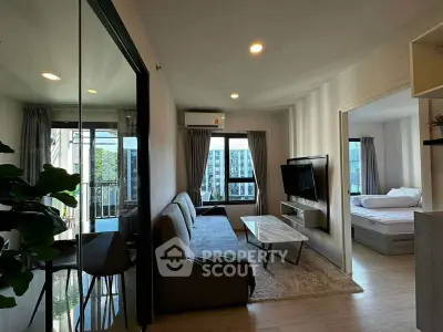 Modern living room with sleek furniture and natural light in urban apartment