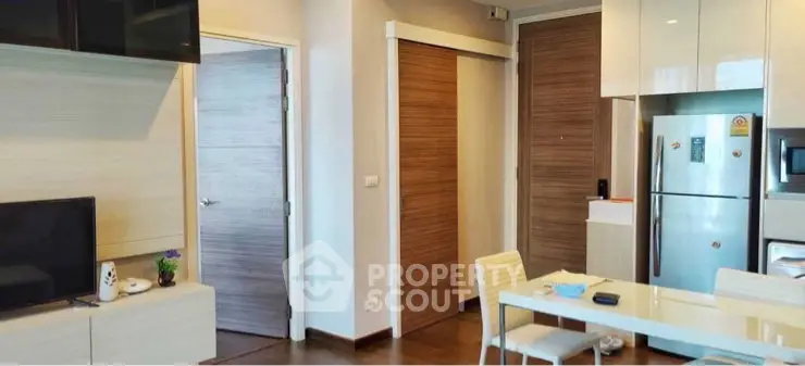 Modern kitchen and dining area with sleek appliances and stylish decor