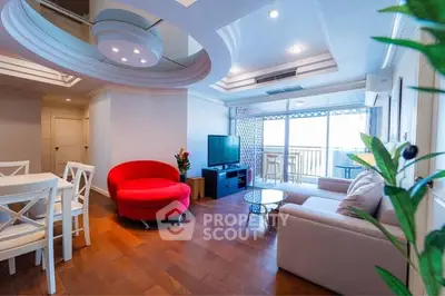 Spacious living room with modern furniture and balcony view