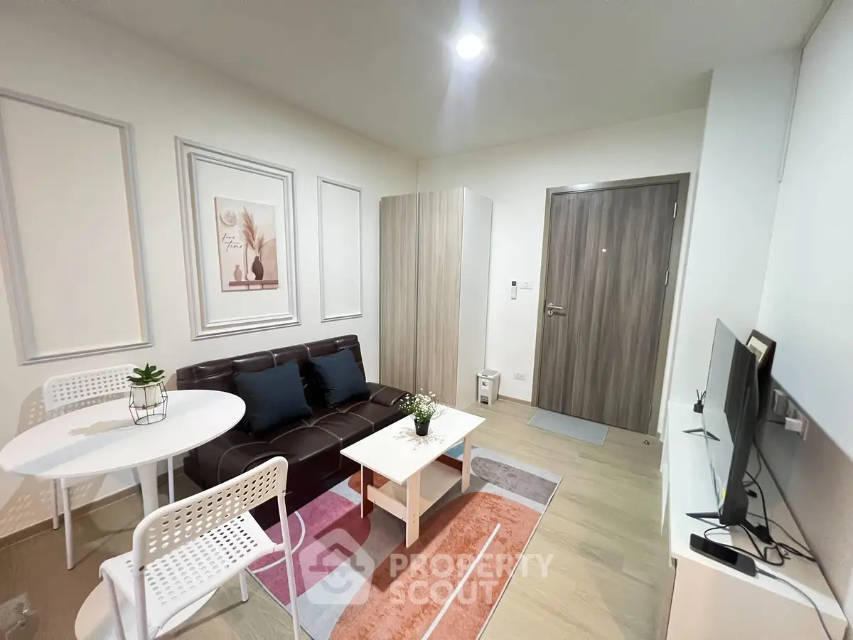 Modern living room with stylish decor and cozy seating area in a contemporary apartment.
