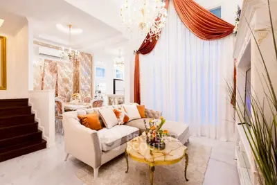 Luxurious living room with elegant decor and chandelier lighting