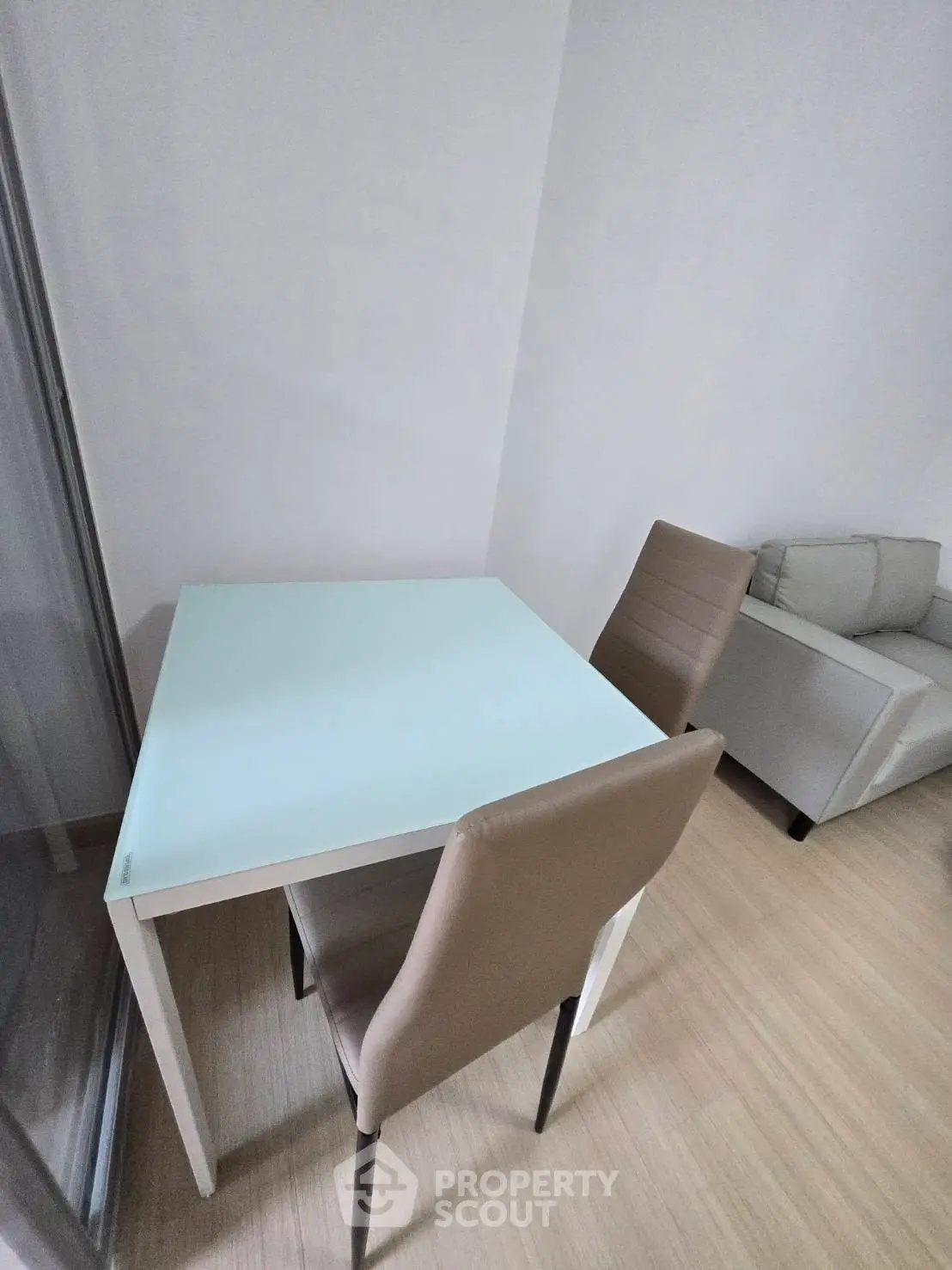 Modern minimalist living room with sleek furniture and wooden flooring