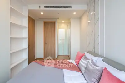 Modern bedroom with stylish decor and ample natural light