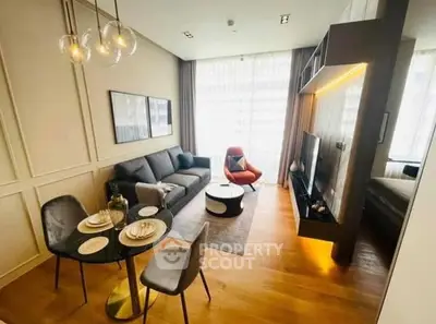 Modern living room with stylish decor and open layout, featuring elegant dining area and cozy seating.
