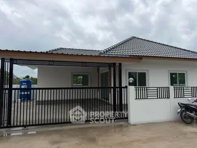 Charming single-story house with modern design and spacious driveway, perfect for family living.