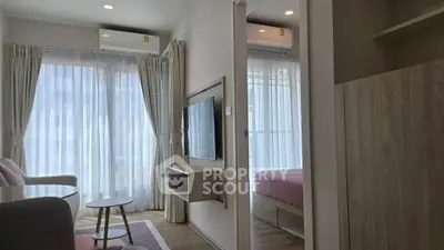 Modern apartment interior with cozy living room and bedroom, featuring large windows and stylish decor.