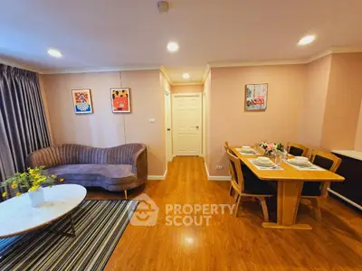 Charming living room with elegant dining area and stylish decor, perfect for modern living.