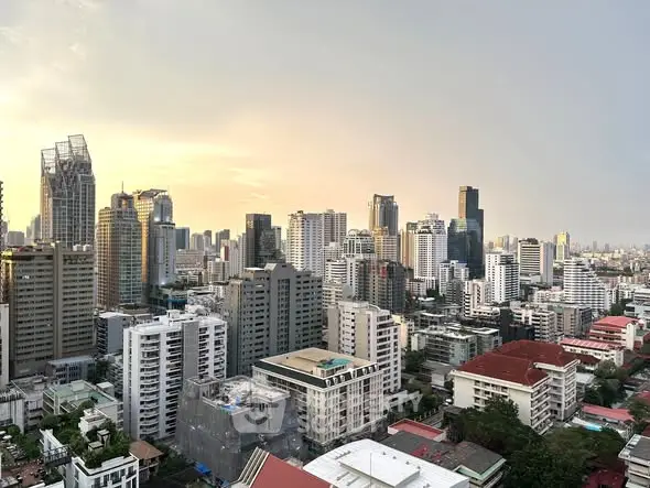 Stunning cityscape view showcasing modern high-rise buildings at sunset.
