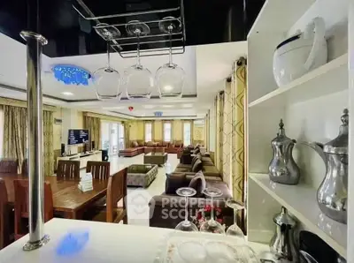 Spacious open-plan living and dining area with elegant decor and ample natural light.