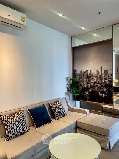 Modern living room with stylish decor and cityscape artwork, featuring a cozy sectional sofa and elegant lighting.