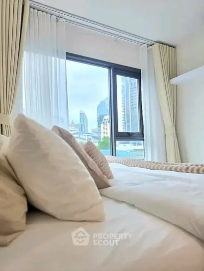 Luxurious bedroom with city view, featuring elegant curtains and plush bedding for ultimate comfort.