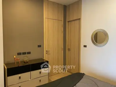 Modern bedroom with stylish decor and wooden accents