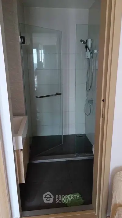Modern bathroom with glass shower enclosure and sleek design