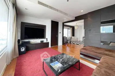 Spacious modern living room with large TV and stylish decor
