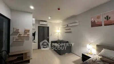 Modern living room with sleek design and cozy ambiance, featuring stylish furniture and contemporary decor.