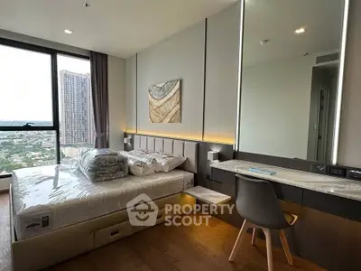 Luxurious bedroom with modern decor and stunning city view, featuring a cozy bed and stylish furniture.