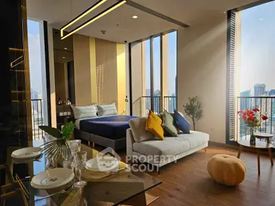 Luxurious modern studio with panoramic city views, elegant decor, and open layout for sophisticated urban living.