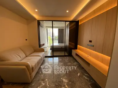 Modern living room with marble flooring and cozy lighting