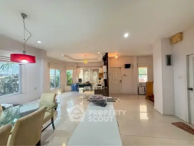 Spacious open-plan living area with modern decor and ample natural light.