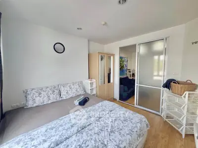 Cozy bedroom with modern decor and ample storage space